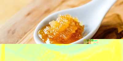 Crystallized honey on a wooden spoon